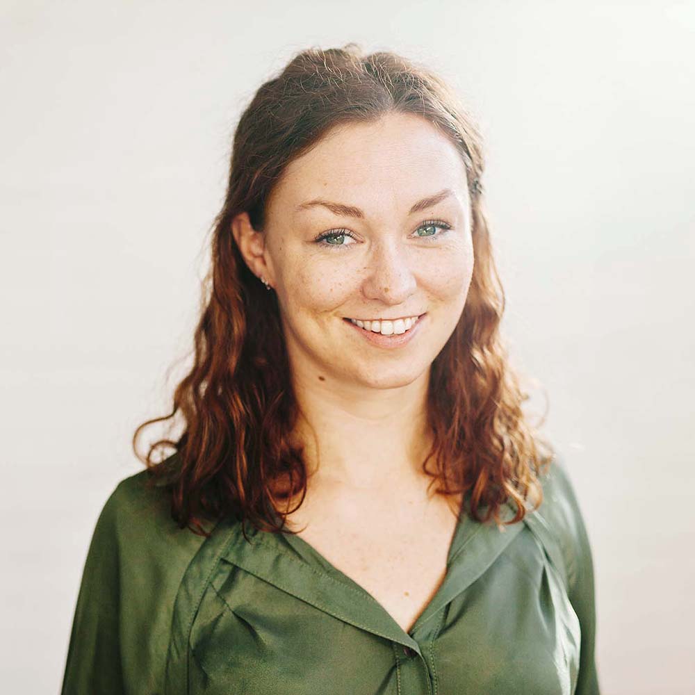 portrait of mid adult businesswoman smiling agains 5f3s7x7.jpg